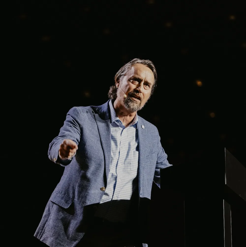 Michael J. Kruger speaking from a podium
